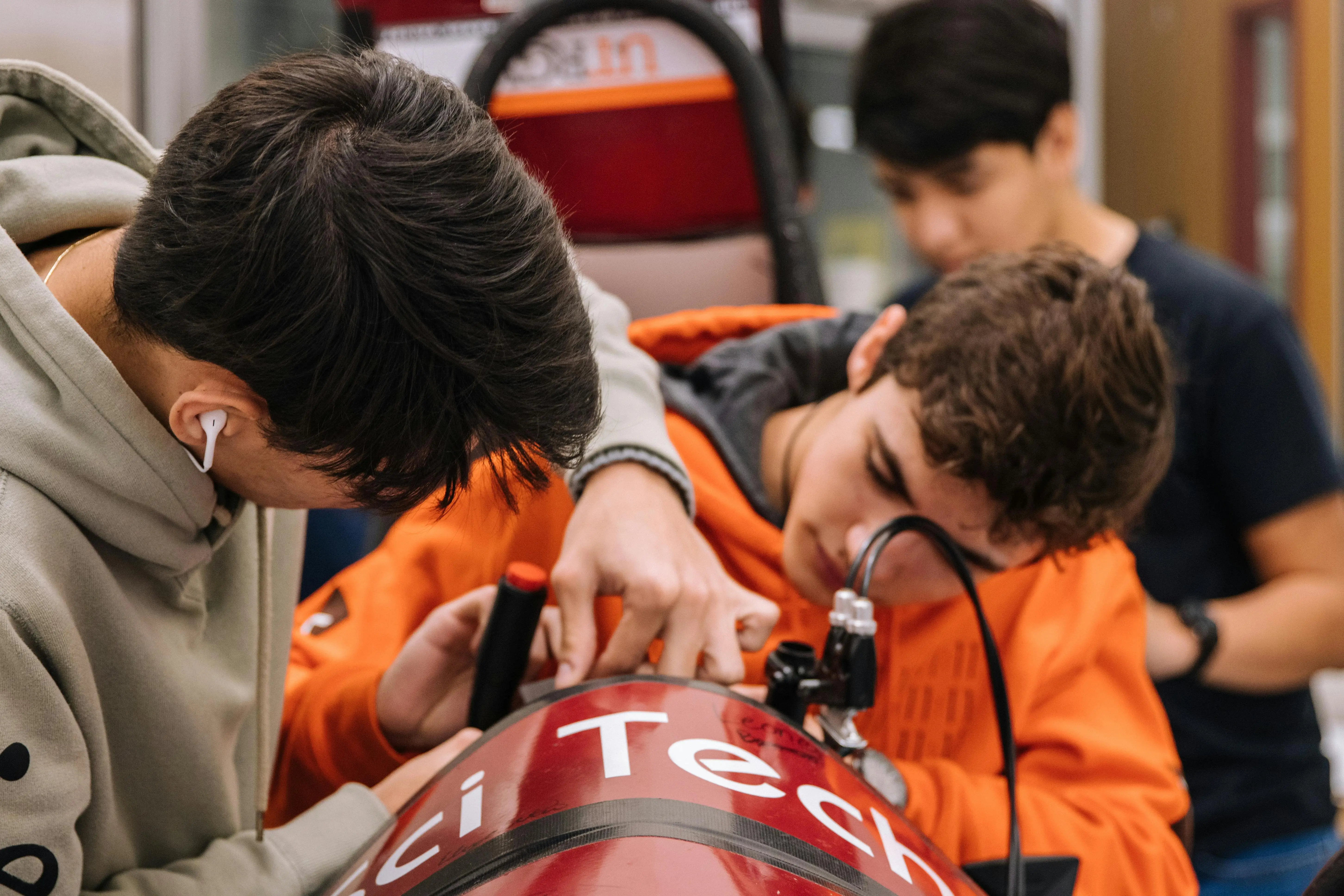 A group of students working on the mechanics of an engineering project
